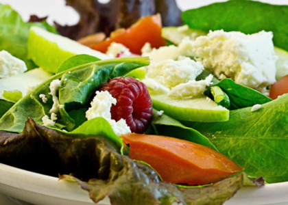 Nutrition: Healthy salad with romaine, raspberries, tomatoes and other healthy vegetables